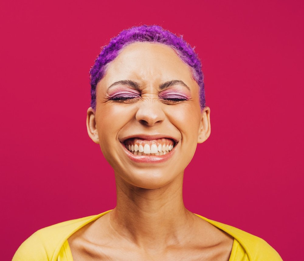 Person smiling with eyes closed